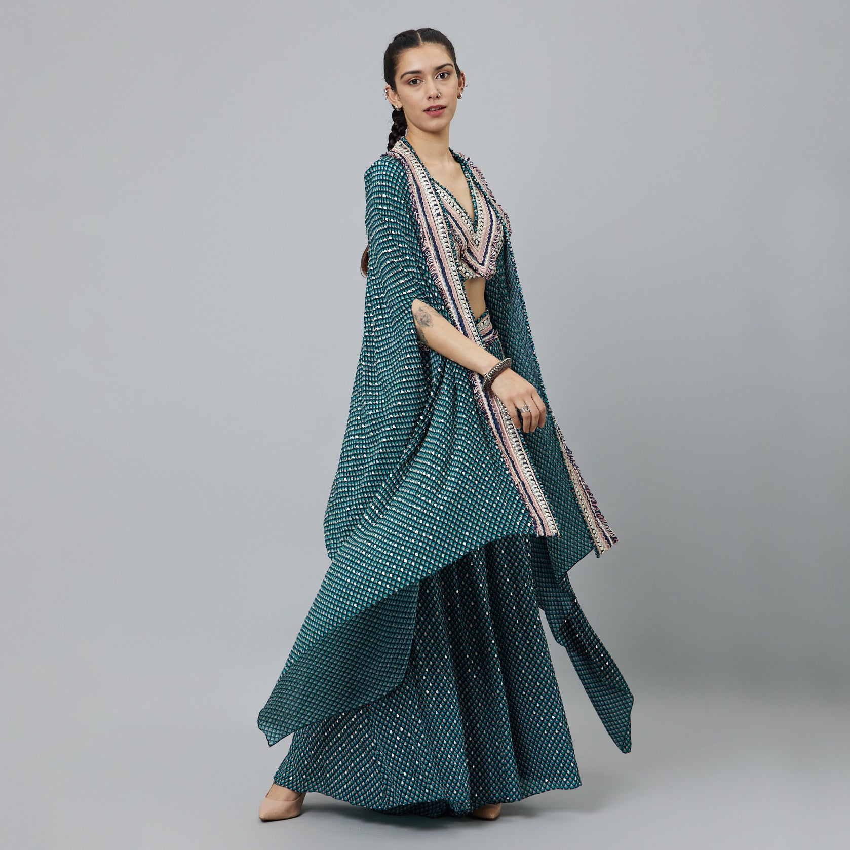 TEXTURED CROP TOP TEAMED WITH EMBELLISHED BLUE BUTTI PRINT BOX PLEAT PANTS HIGHLIGHTED CAPE