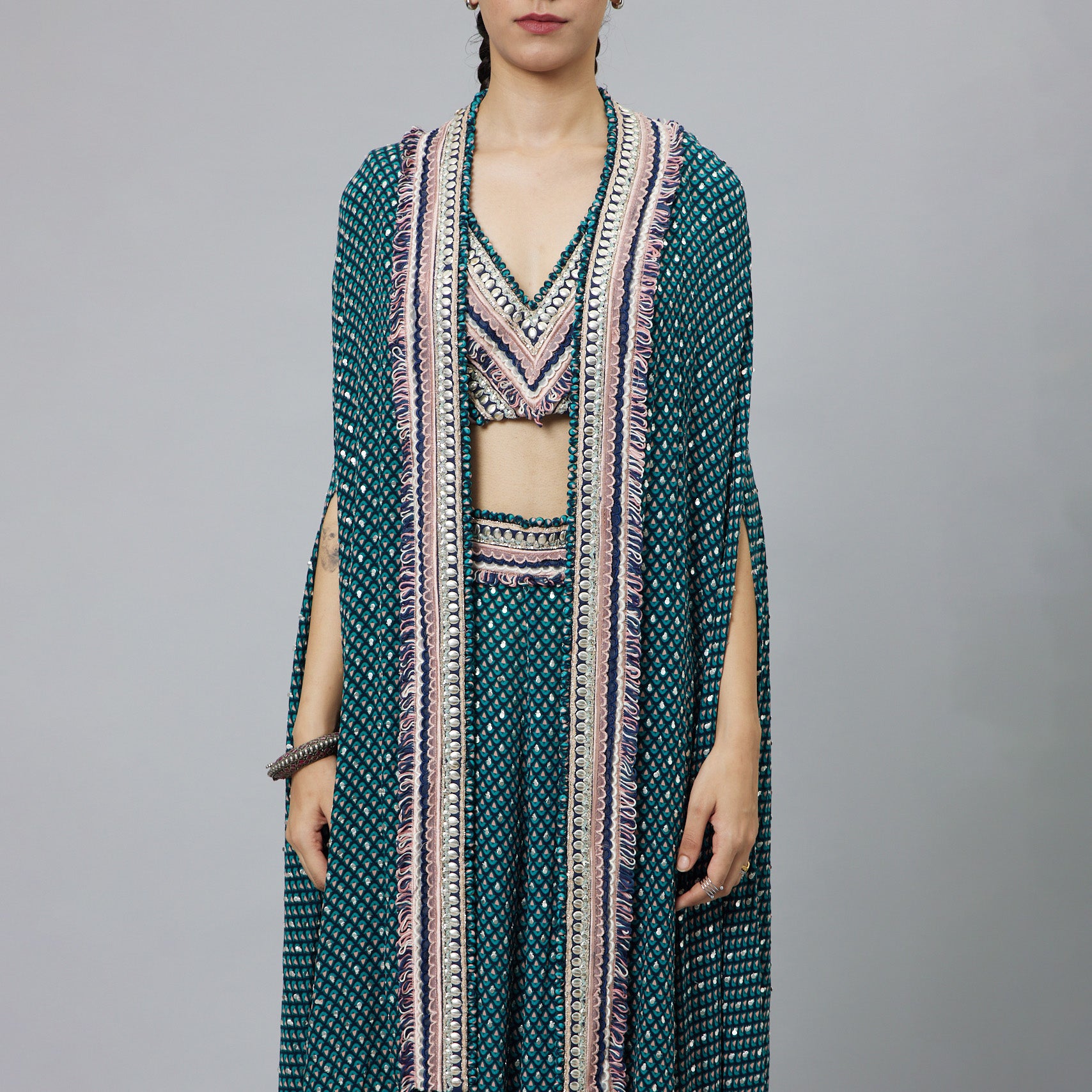 TEXTURED CROP TOP TEAMED WITH EMBELLISHED BLUE BUTTI PRINT BOX PLEAT PANTS HIGHLIGHTED CAPE