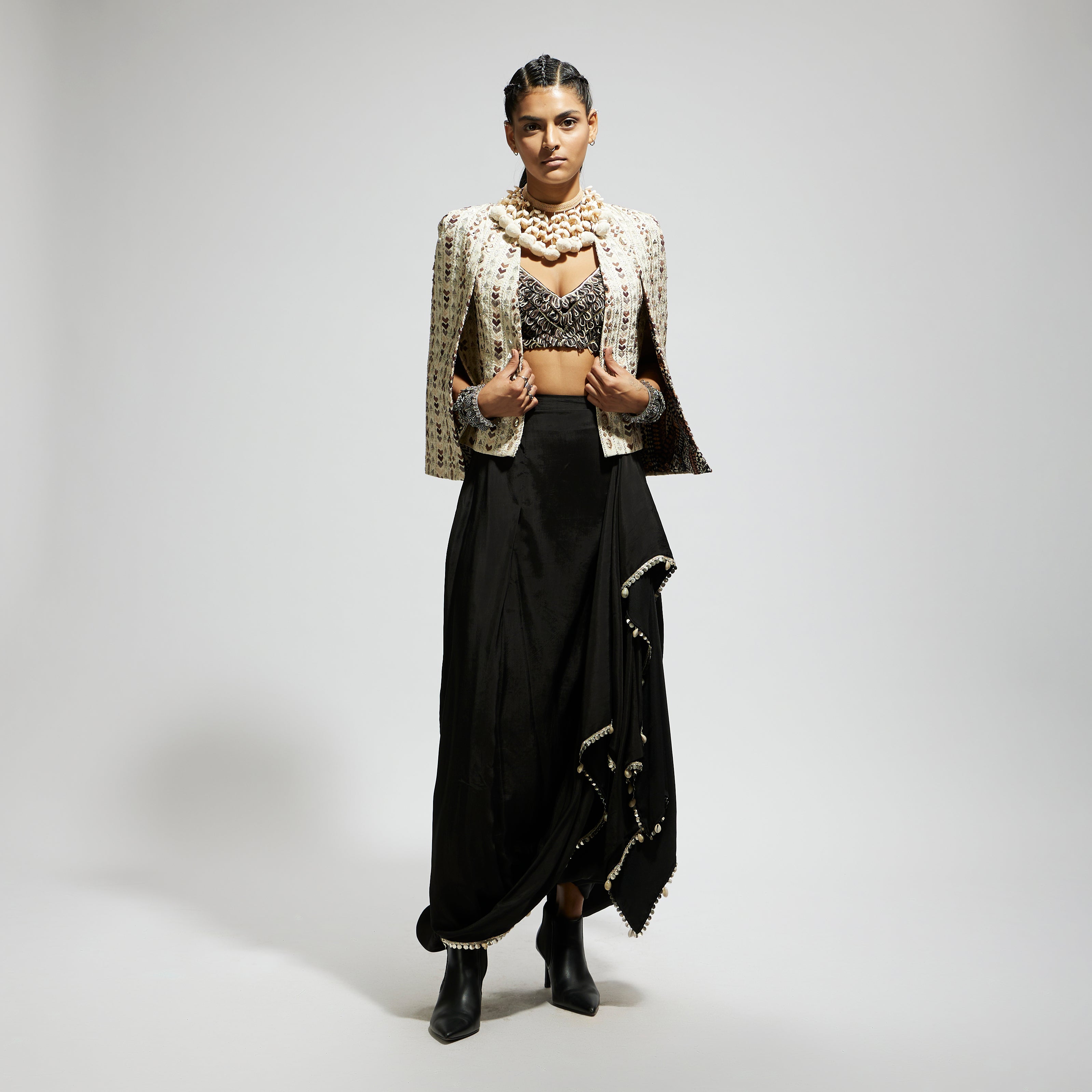 IVORY EMBELLISHED CAPE JACKET PAIRED WITH TEXTURED BUSTIER AND DRAPE SKIRT