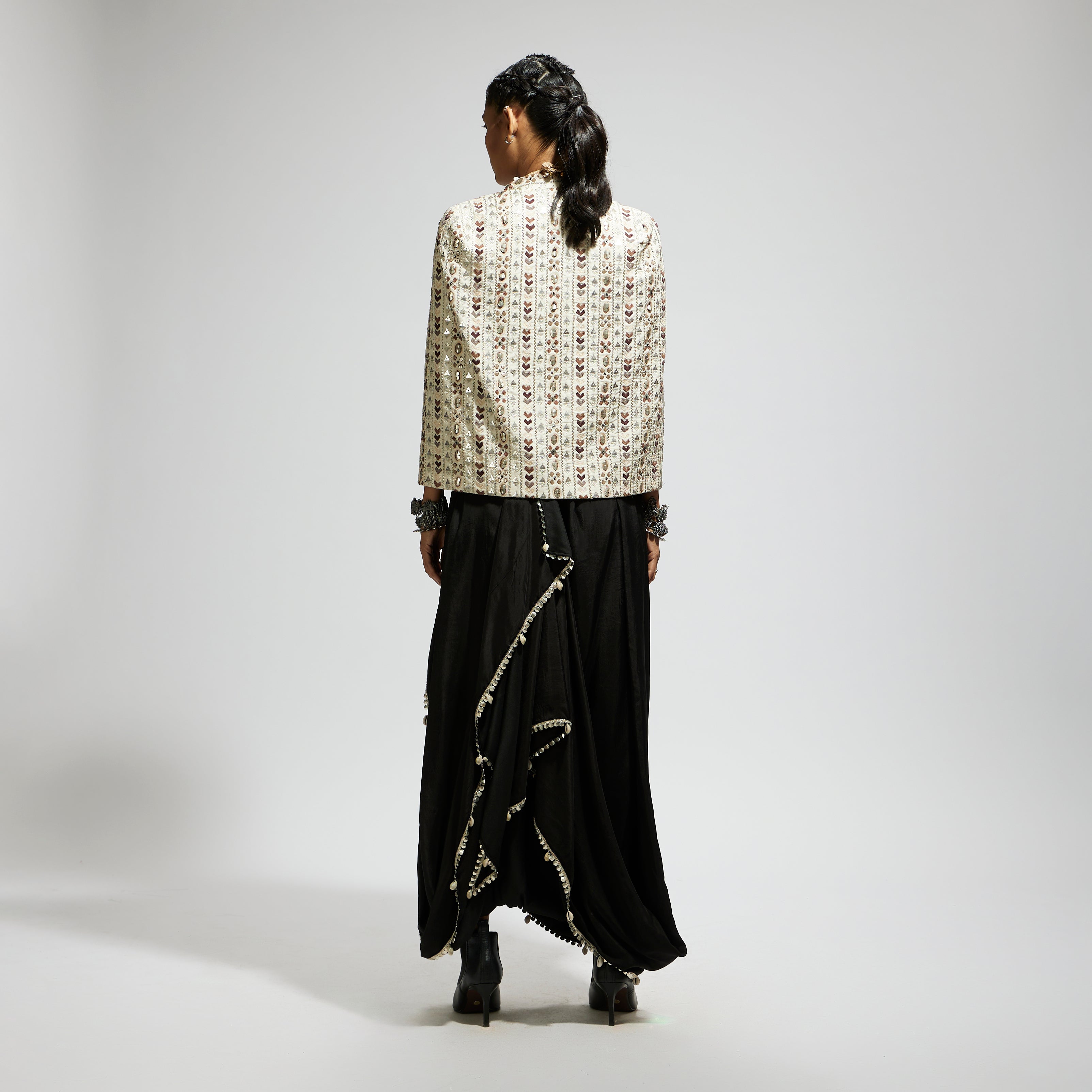 IVORY EMBELLISHED CAPE JACKET PAIRED WITH TEXTURED BUSTIER AND DRAPE SKIRT