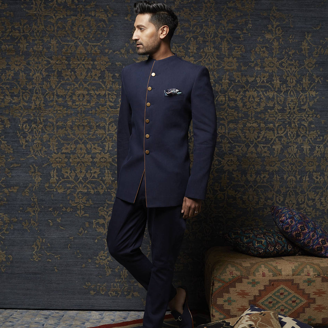 Dark blue Denim bandhgala with sued detailing paired with denim jodhpuri pants