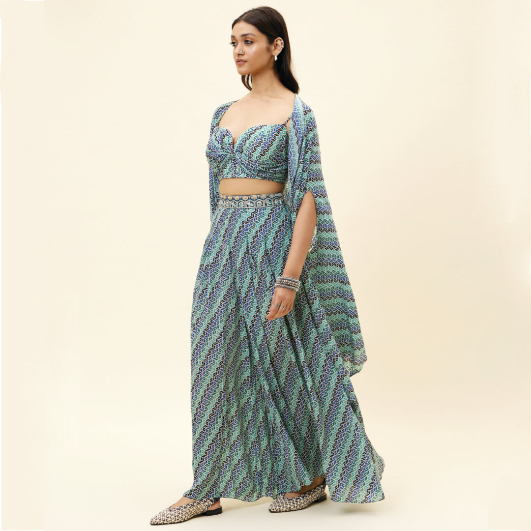 BEIGE LEAF PRINT BOX PLEATED PANTS WITH BIKINI BUSTIER AND CAPE