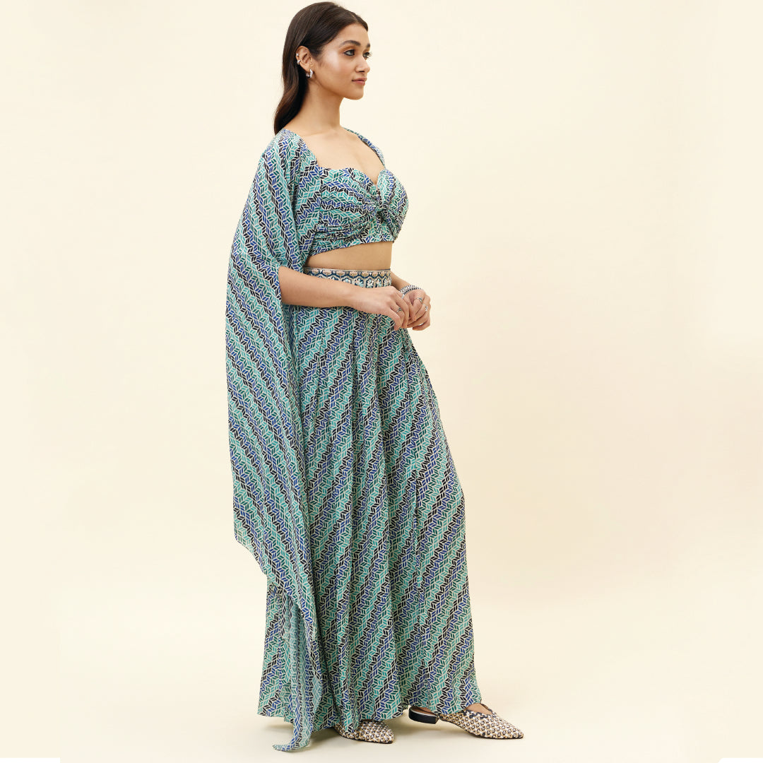 BEIGE LEAF PRINT BOX PLEATED PANTS WITH BIKINI BUSTIER AND CAPE