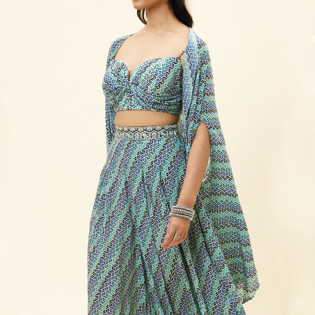 BEIGE LEAF PRINT BOX PLEATED PANTS WITH BIKINI BUSTIER AND CAPE