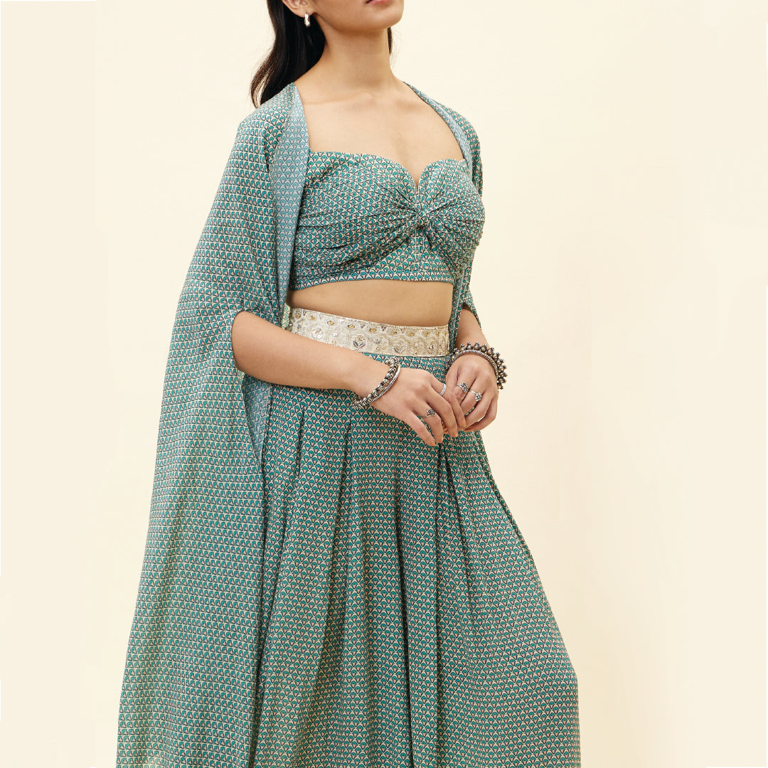 BEIGE BUTTI PRINT BOX PLEATED PANTS WITH BIKINI BUSTIER AND CAPE