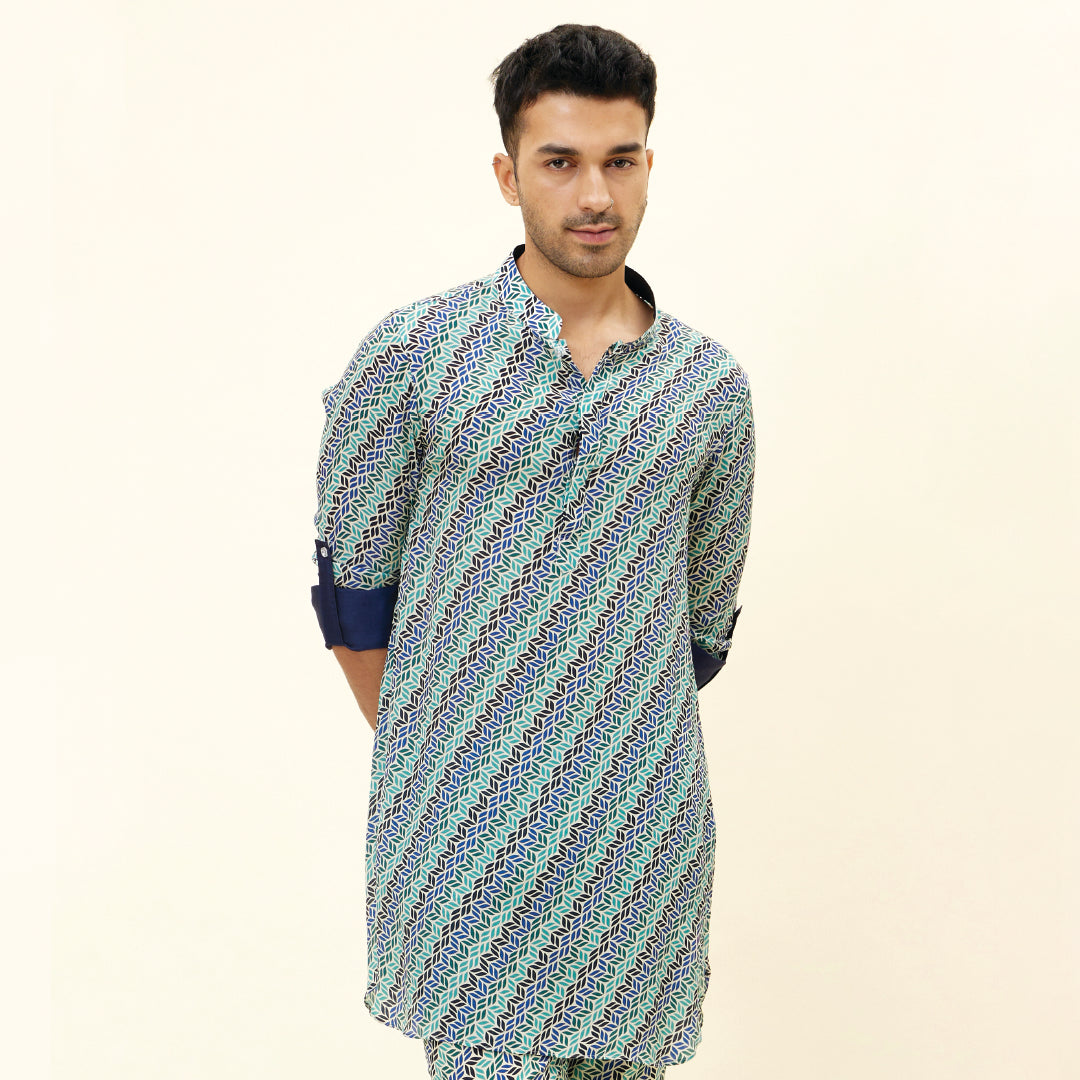 BEIGE LEAF PRINT SHORT SHIRT STYLE KURTA WITH ROLLED UP SLEEVES WITH BEIGE LEAF PRINT PANTS