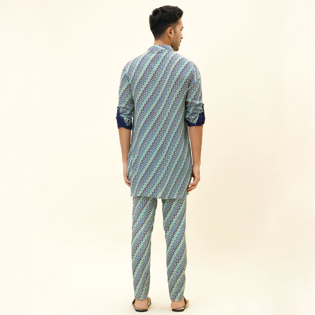 BEIGE LEAF PRINT SHORT SHIRT STYLE KURTA WITH ROLLED UP SLEEVES WITH BEIGE LEAF PRINT PANTS