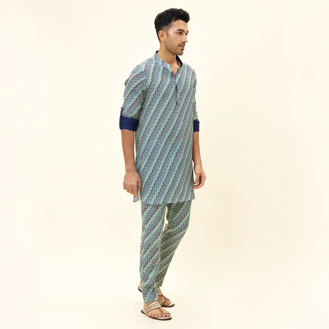 BEIGE LEAF PRINT SHORT SHIRT STYLE KURTA WITH ROLLED UP SLEEVES WITH BEIGE LEAF PRINT PANTS
