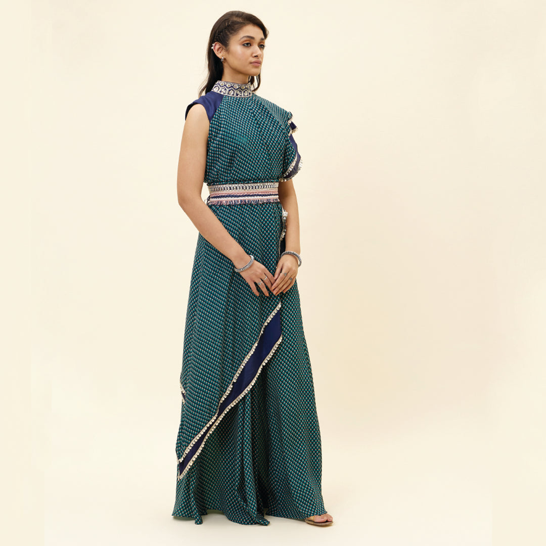 BLUE CROP TOP WITH BLUE BUTTI PRINT DRAPE AND BLUE SOLID PLAIN SILK DRAPE WITH BLUE BUTTI PRINT SHARARA PANTS AND EMB BELT