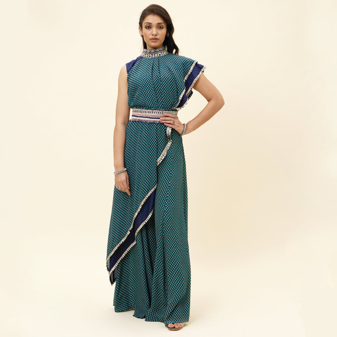 BLUE CROP TOP WITH BLUE BUTTI PRINT DRAPE AND BLUE SOLID PLAIN SILK DRAPE WITH BLUE BUTTI PRINT SHARARA PANTS AND EMB BELT