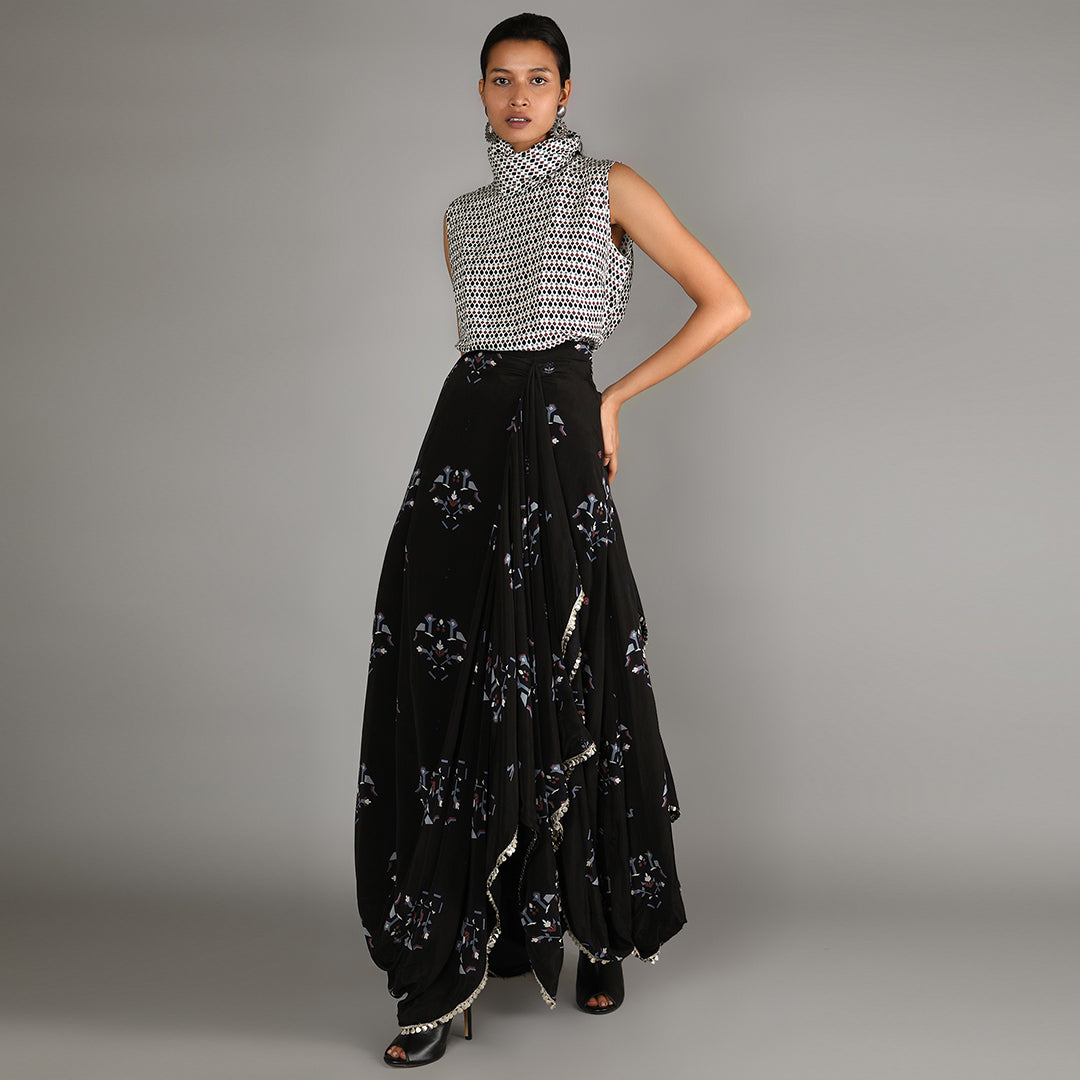 Jaali Print White Turtle Neck Top Paired With Black Bird Print Drape Skirt With Cape