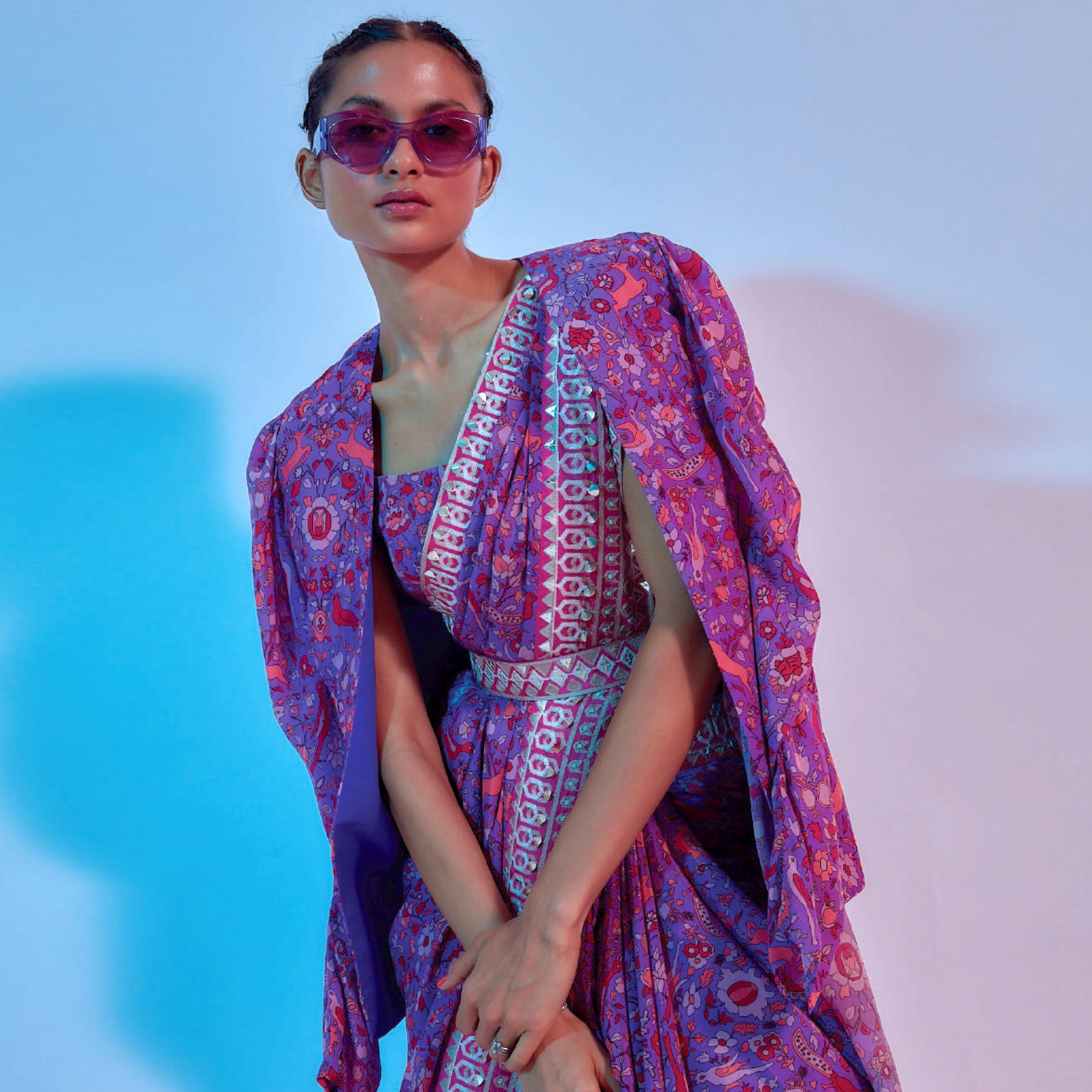 PURPLE SAANJH FLORAL PRINTED SAREE WITH HOT PINK EMBELLISHED BORDER TEAMED WITH A PRINTED BUSTIER AND JACKET