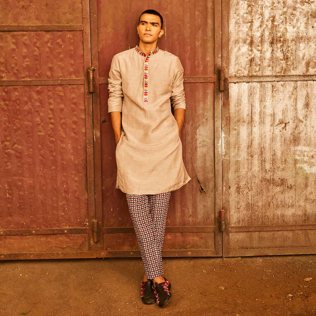 CONCRETE GREY KURTA WITH HIGHLIGHTED COLLAR AND PATTI TEAMED WITH PANTS