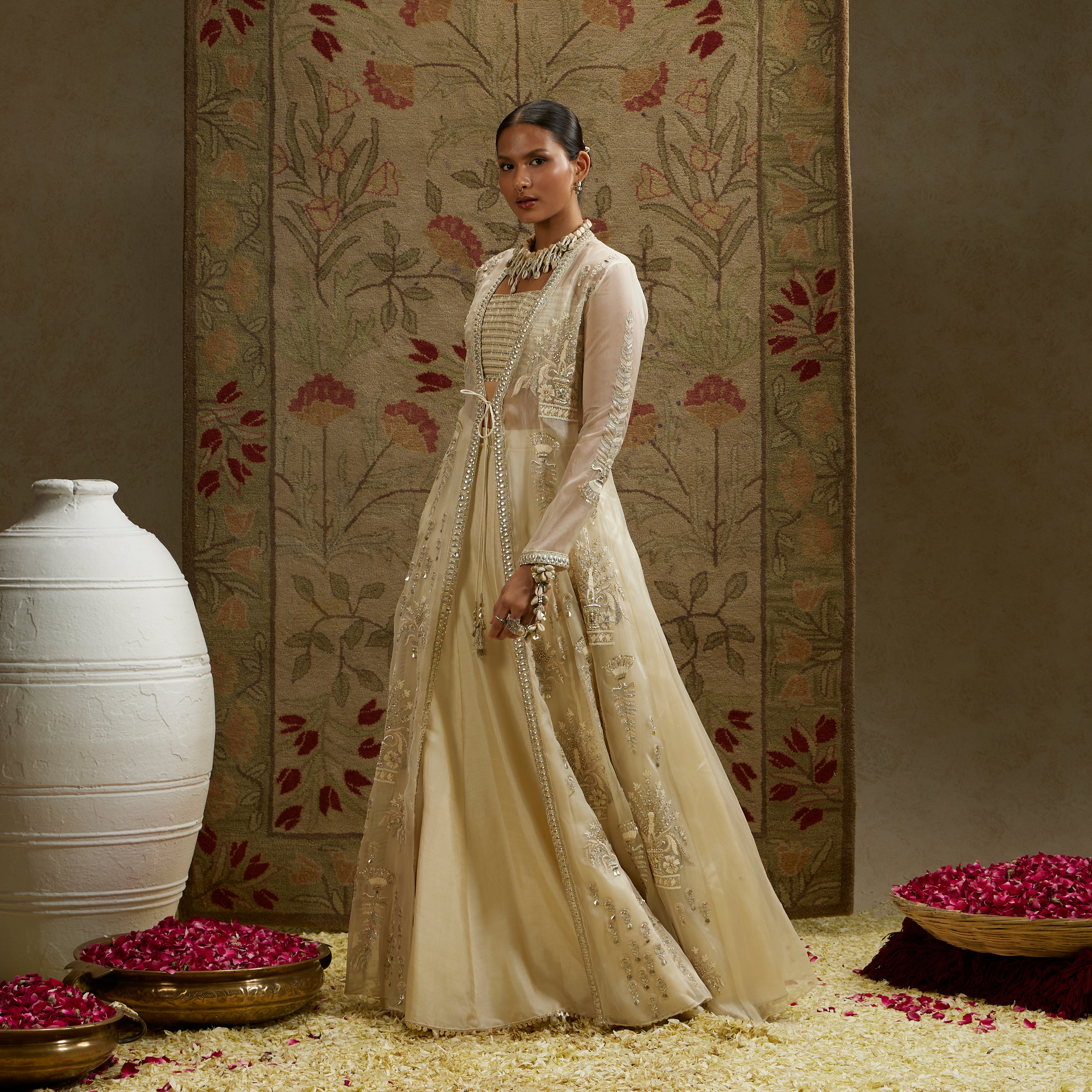 MAGNOLIA ORGANZA EMBELLISHED JACKET PAIRED WITH METAL BUSTIER AND LEHENGA