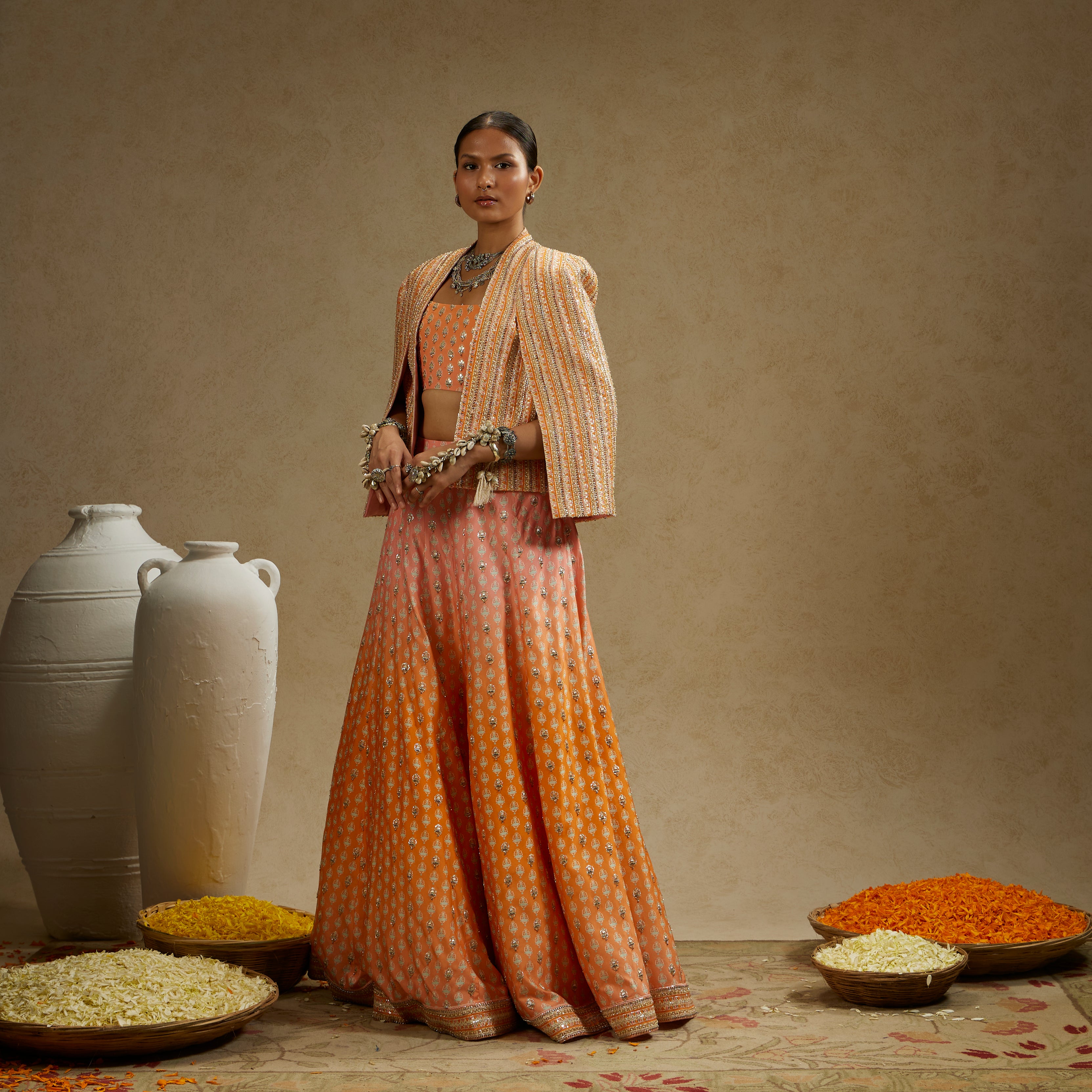 BORDER EMBELLISHED NOOR JACKET PAIRED WITH EMBELLISHED BUSTIER AND OMBRE EMBELLISHED LEHENGA