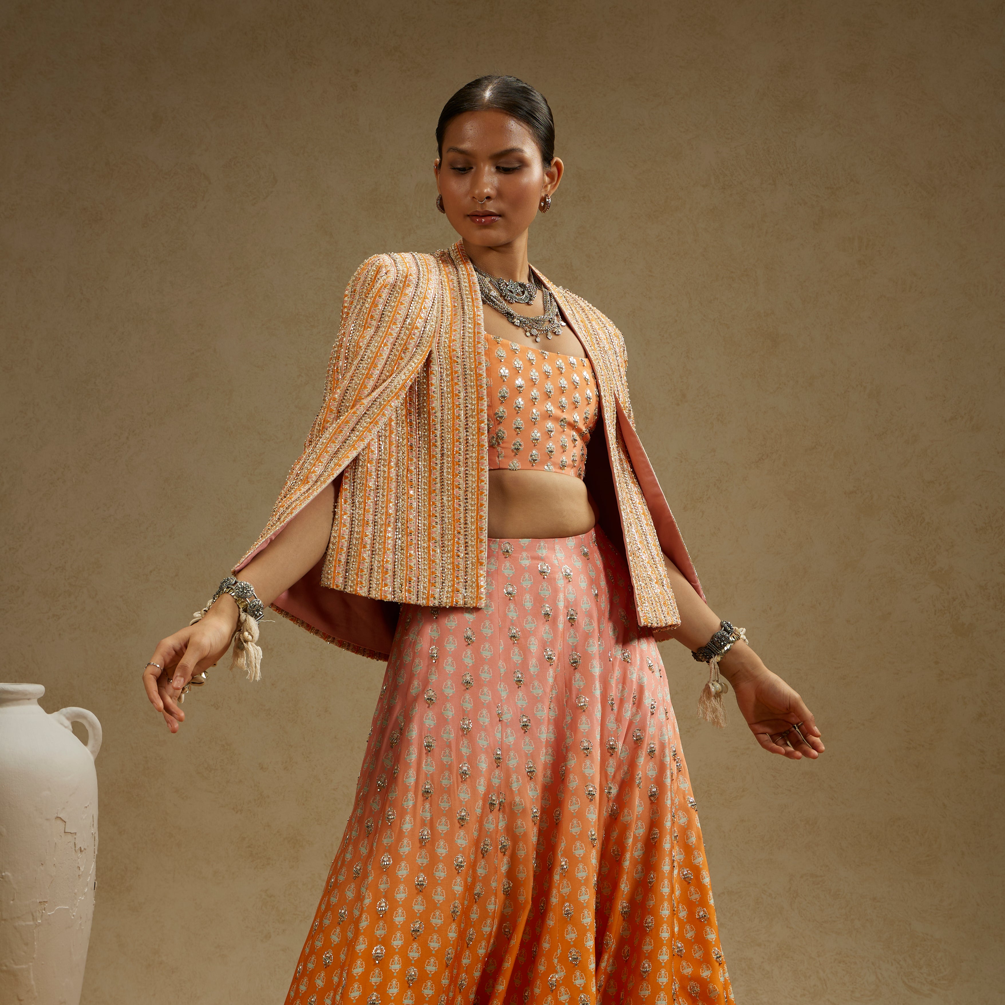 BORDER EMBELLISHED NOOR JACKET PAIRED WITH EMBELLISHED BUSTIER AND OMBRE EMBELLISHED LEHENGA