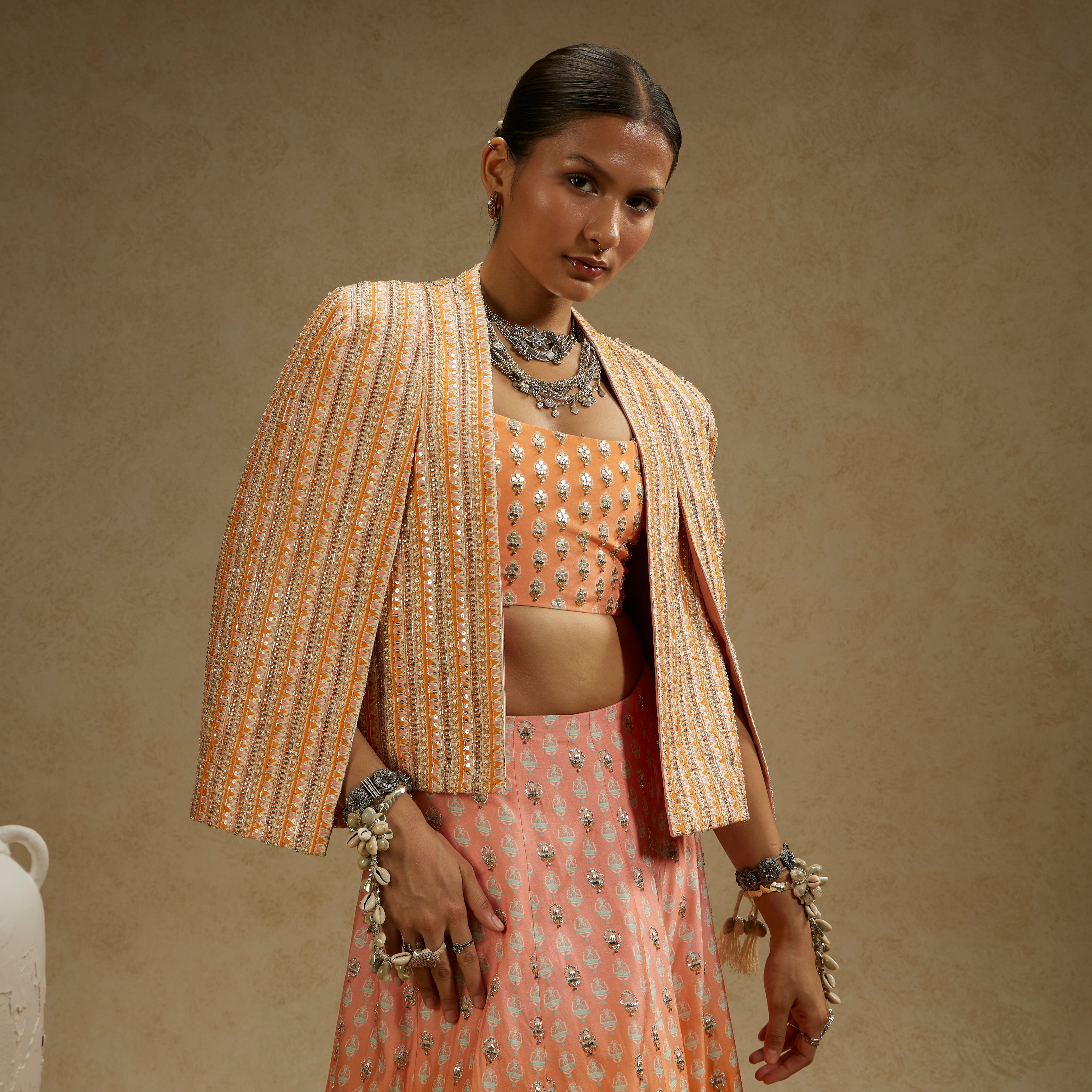 BORDER EMBELLISHED NOOR JACKET PAIRED WITH EMBELLISHED BUSTIER AND OMBRE EMBELLISHED LEHENGA