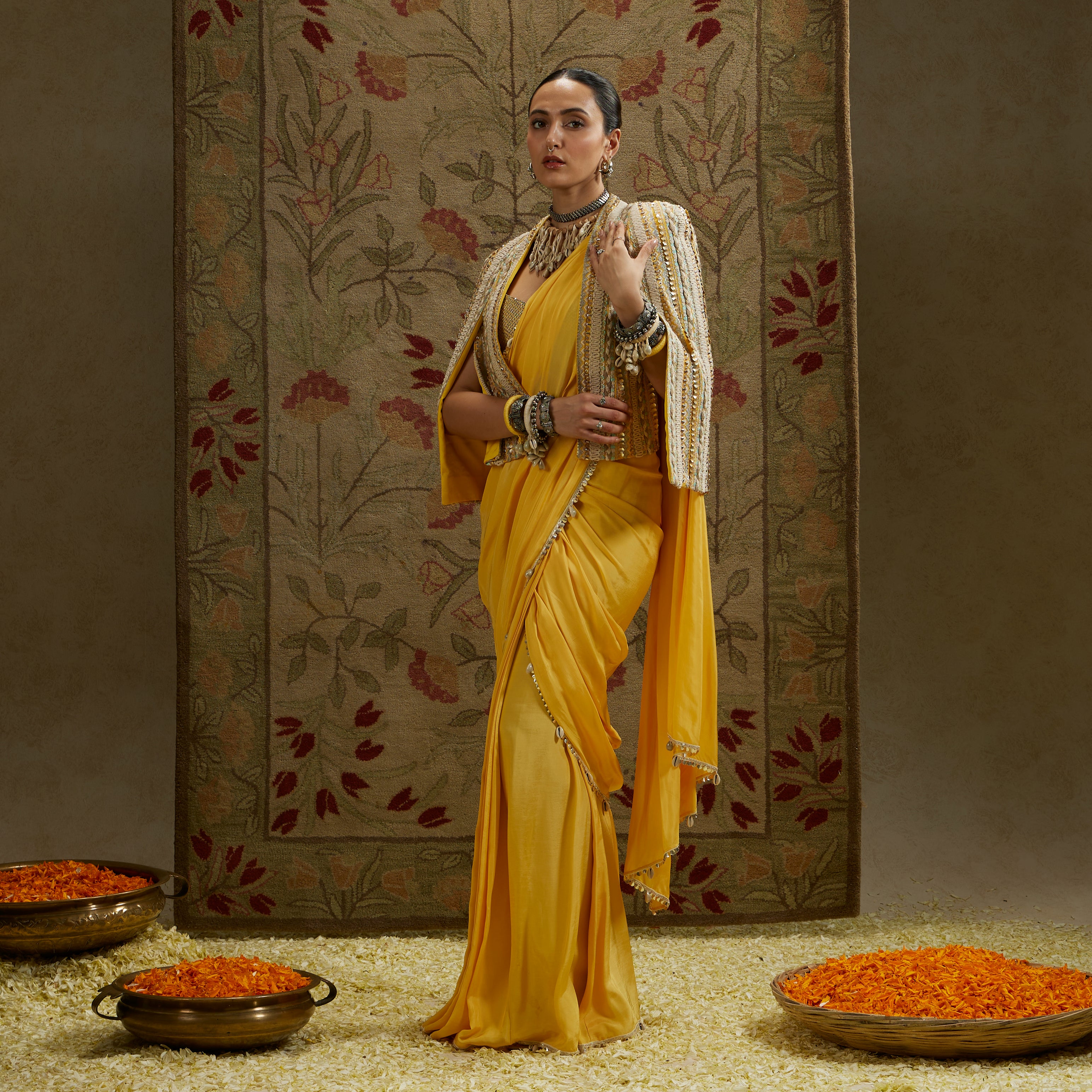 Dandelion Pre-Draped Saree Paired With Metal Embellished Bustier And Embellished Cape Jacket