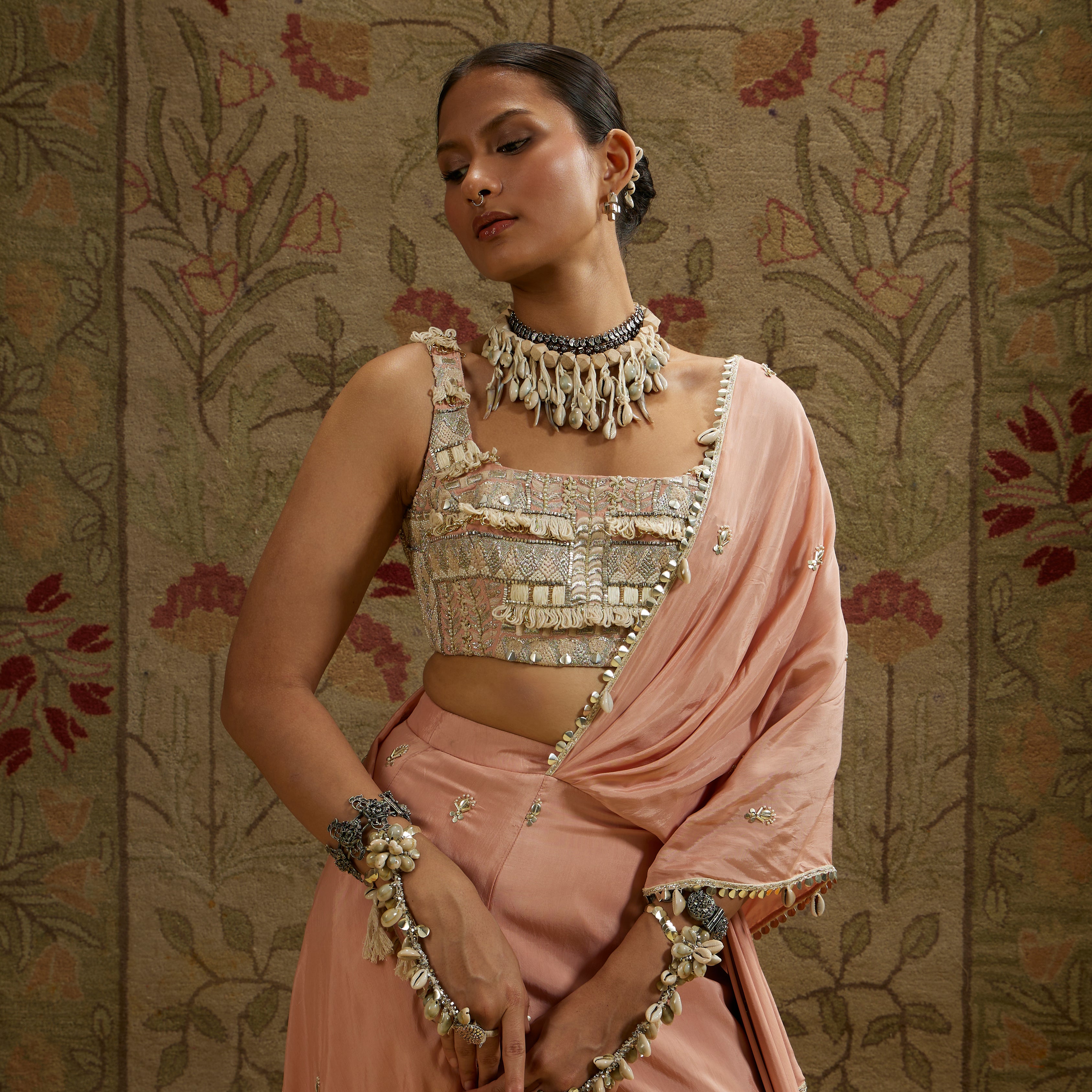 PINK EMBELLISHED SAREE PAIRED WITH EMBELLISHED BUSTIER AND DRAPED SKIRT