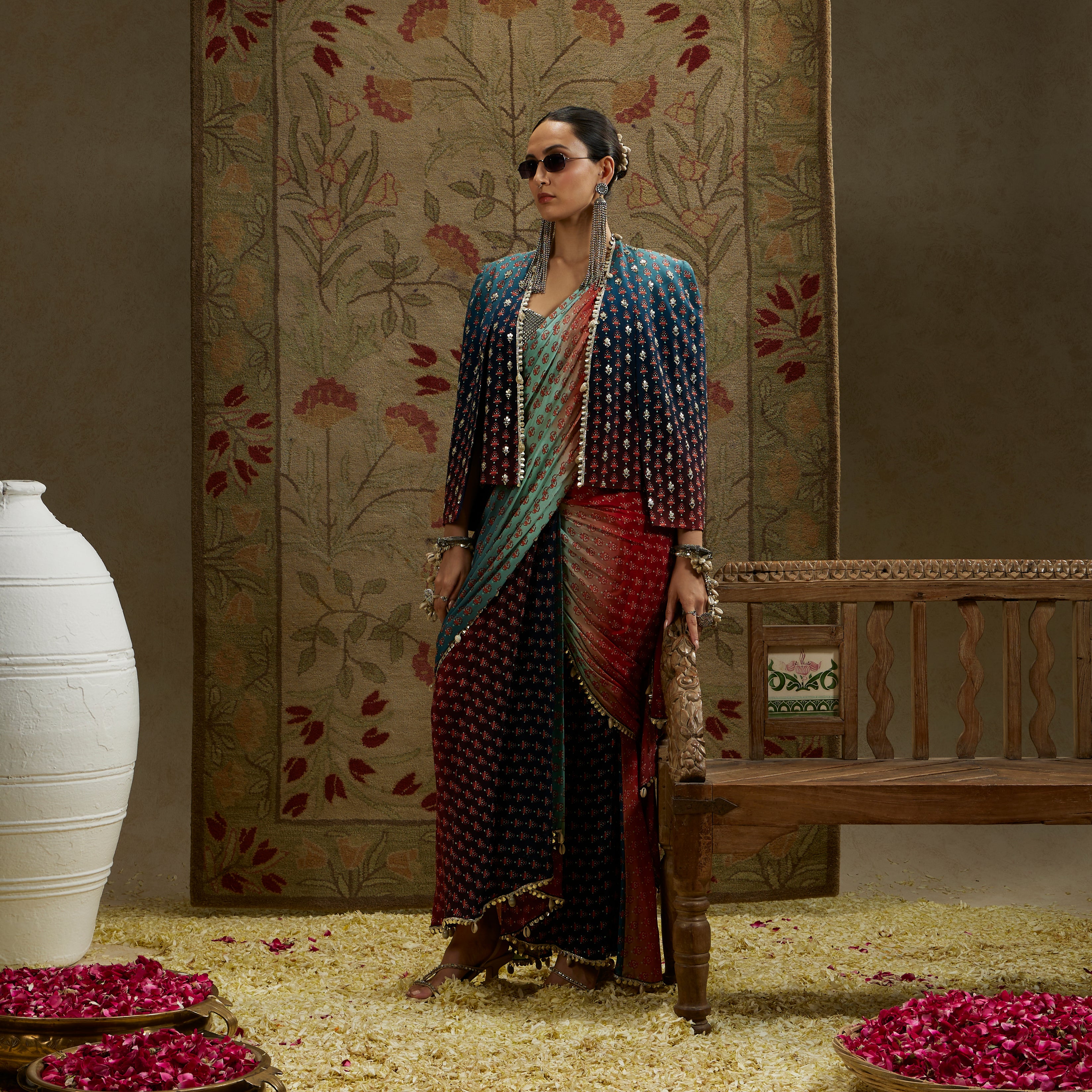 RED & BLUE OMBRE PRINT CASCADE SAREE WITH METAL EMBELLISHED BUSTIER PAIRED WITH BLUE OMBRE EMBELLISHED CAPE JACKET