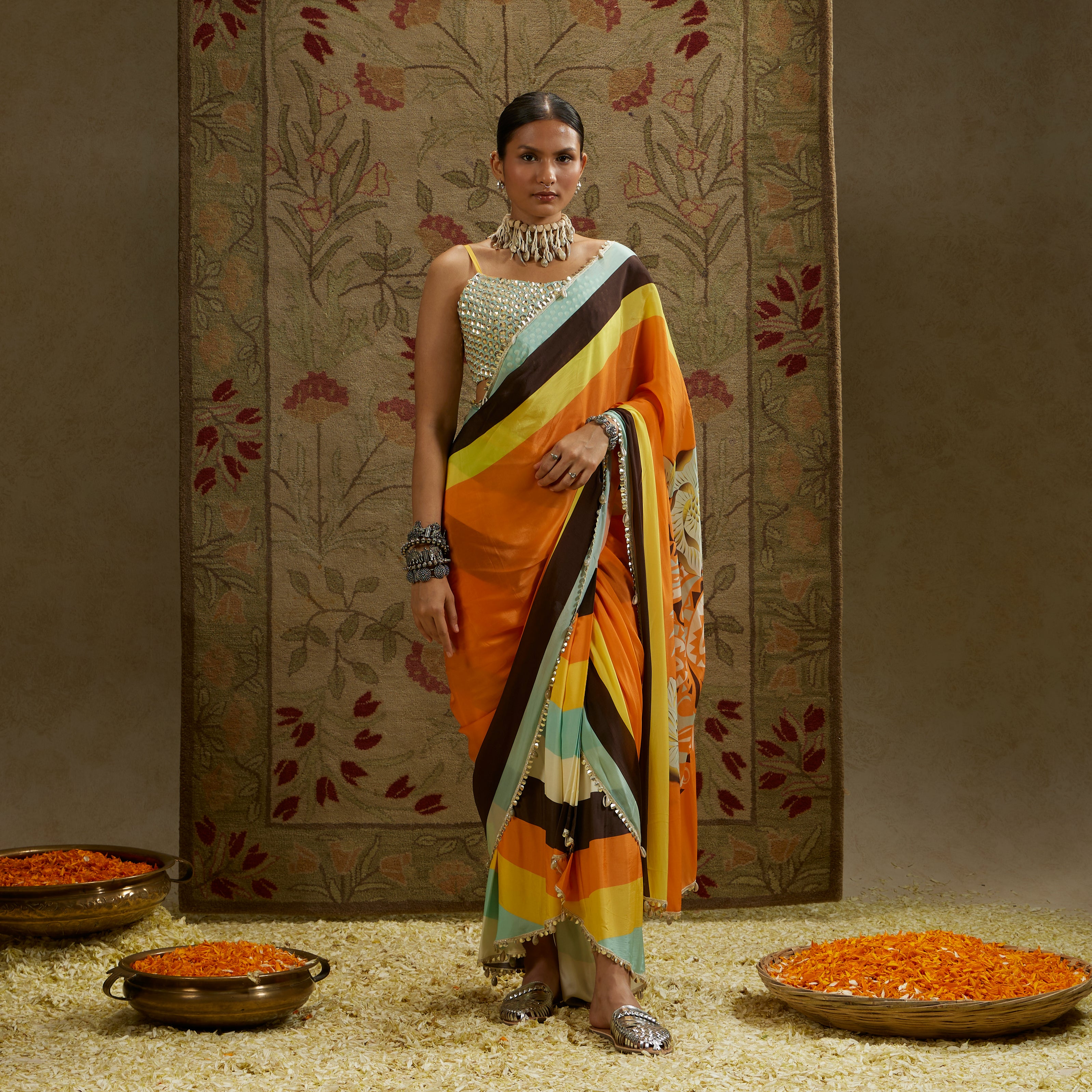 ORANGE MASK PRINT STRIPE PLEATED SAREE WITH METALLIC SCALLOP BUSTIER