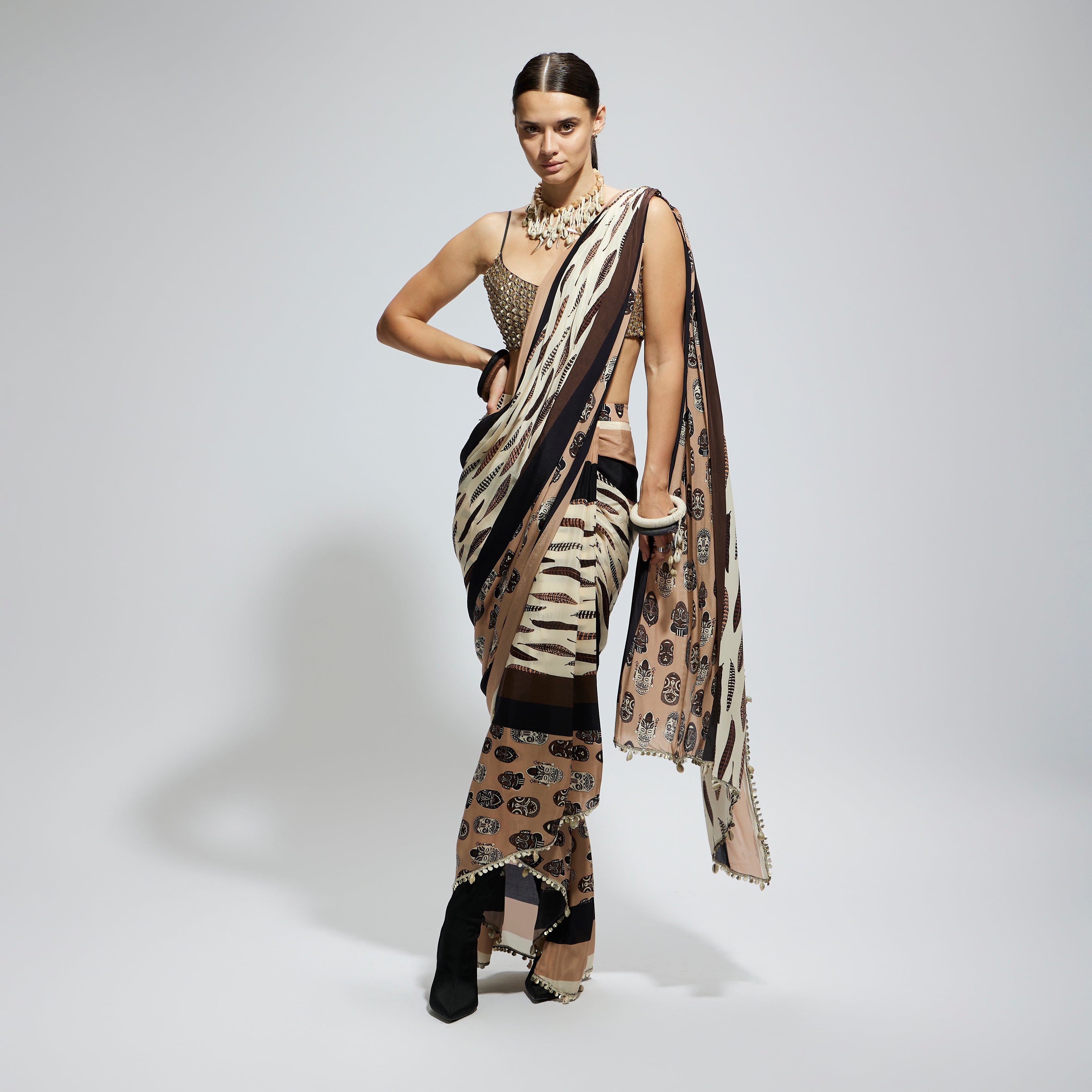 MASK AND FEATHER PRINT CASCADE SAREE PAIRED WITH METALLIC SCALLOP BUSTIER
