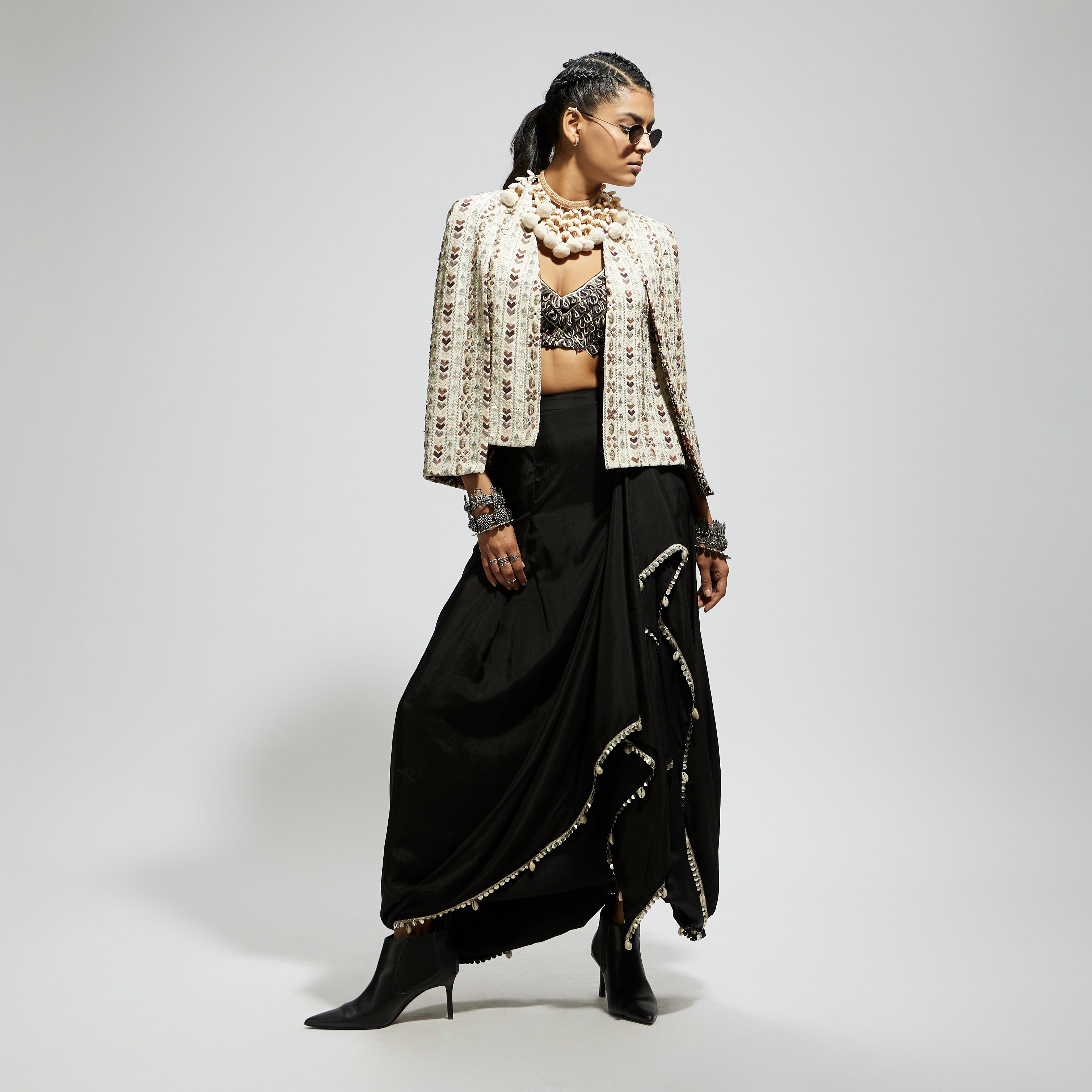 SAMSARA: IVORY EMBELLISHED CAPE JACKET PAIRED WITH TEXTURED BUSTIER AND DRAPE SKIRT