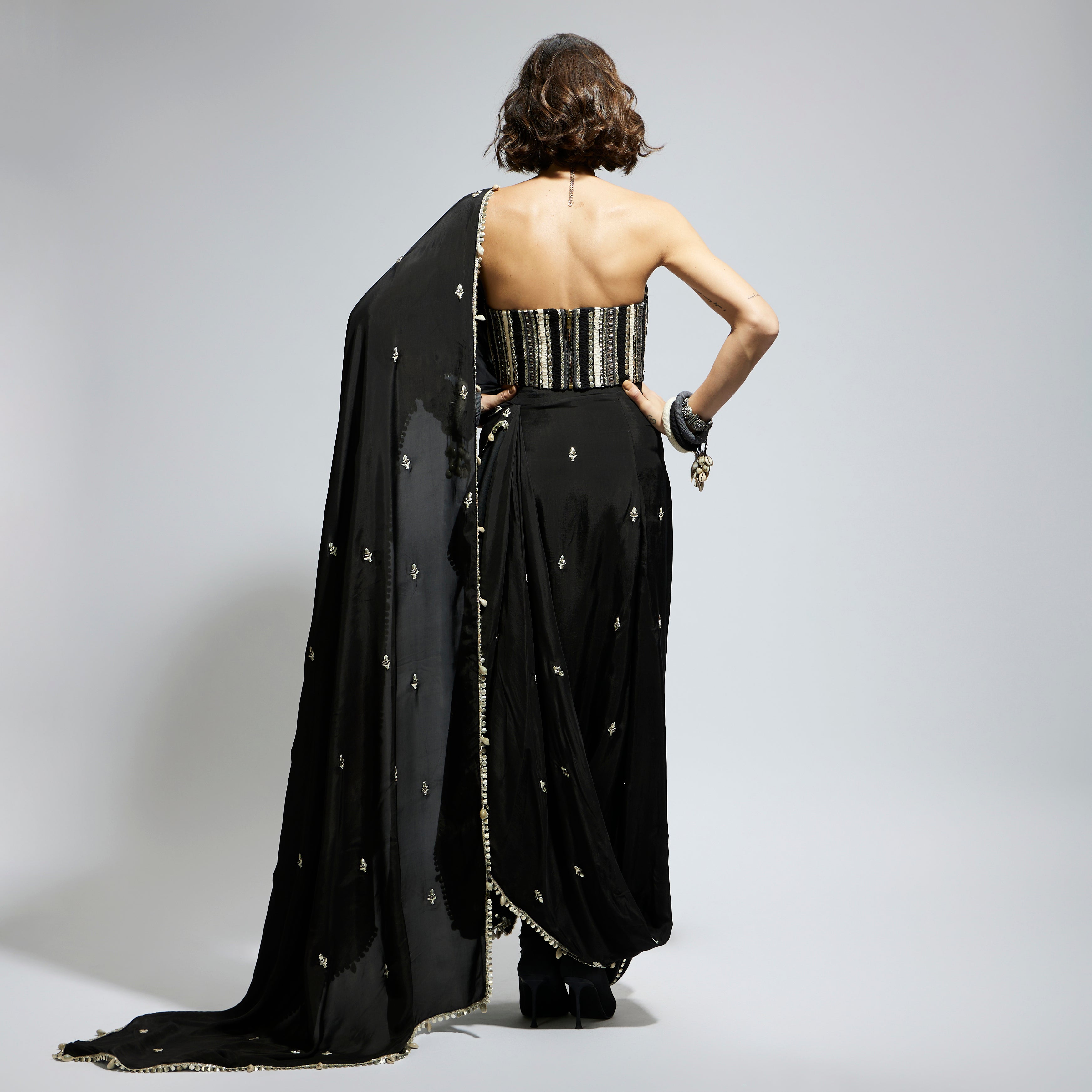 BLACK THREADWORK CORSET PAIRED WITH EMBELLISHED SAREE DRAPED SKIRT