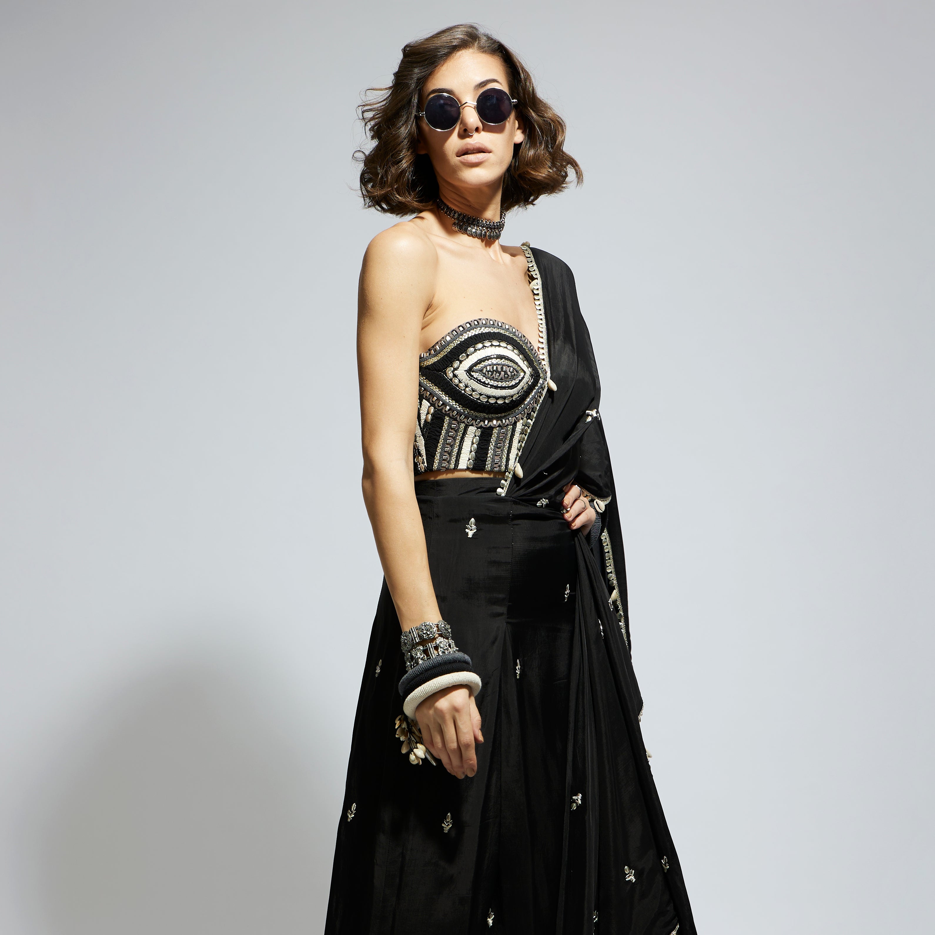 BLACK THREADWORK CORSET PAIRED WITH EMBELLISHED SAREE DRAPED SKIRT