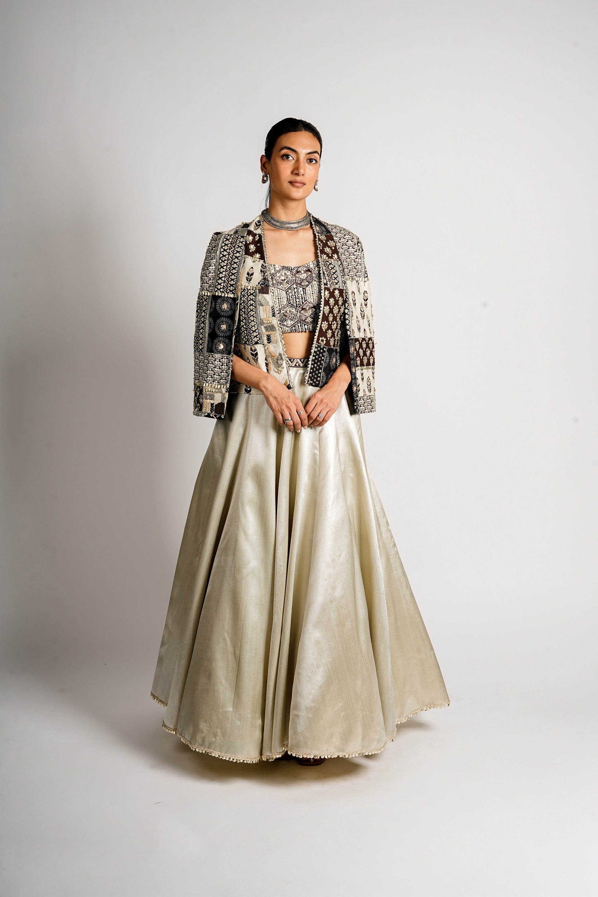 SERA METALLIC LEHENGA WITH BUSTIER AND PATCHWORK CAPE JACKET