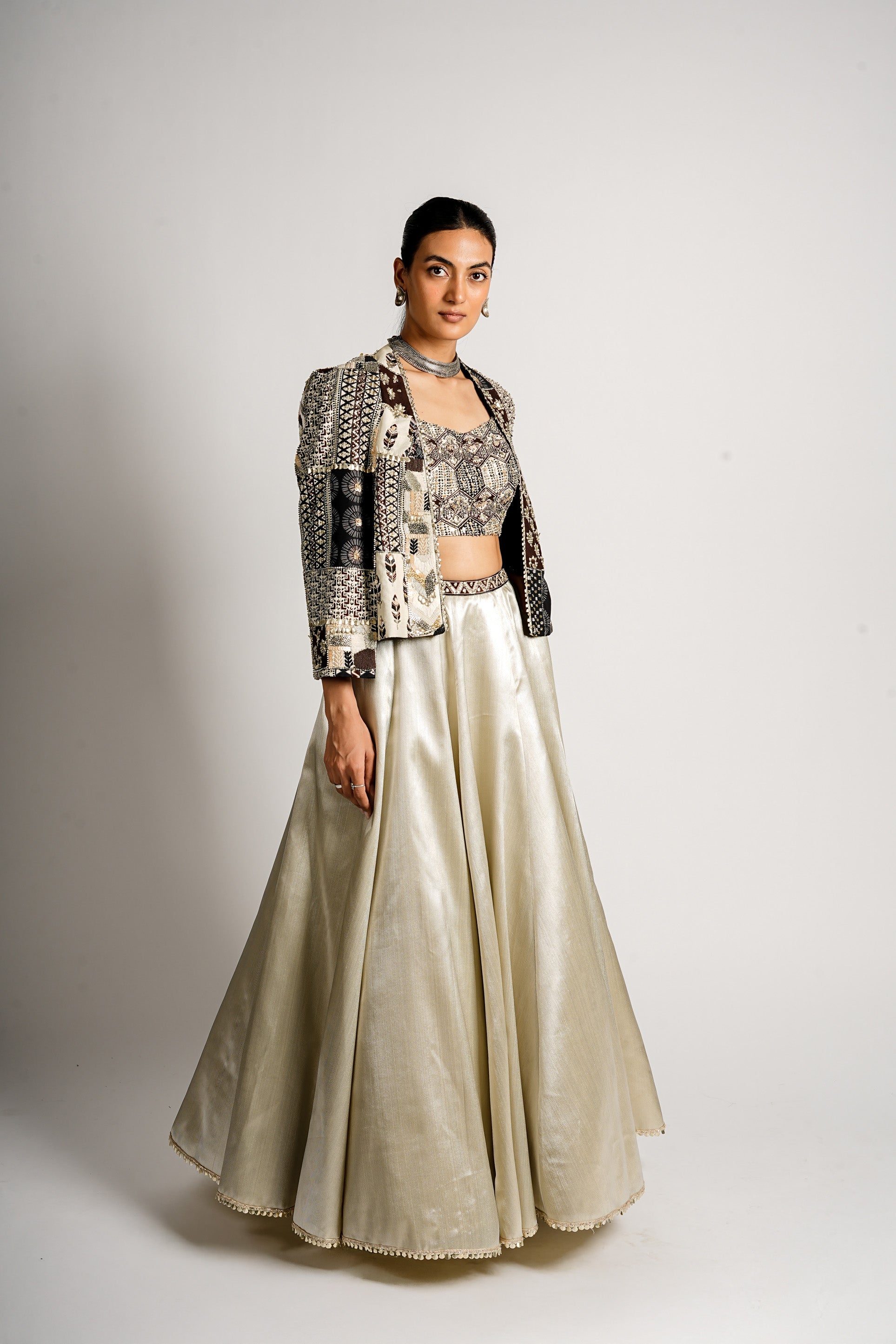 SERA METALLIC LEHENGA WITH BUSTIER AND PATCHWORK CAPE JACKET