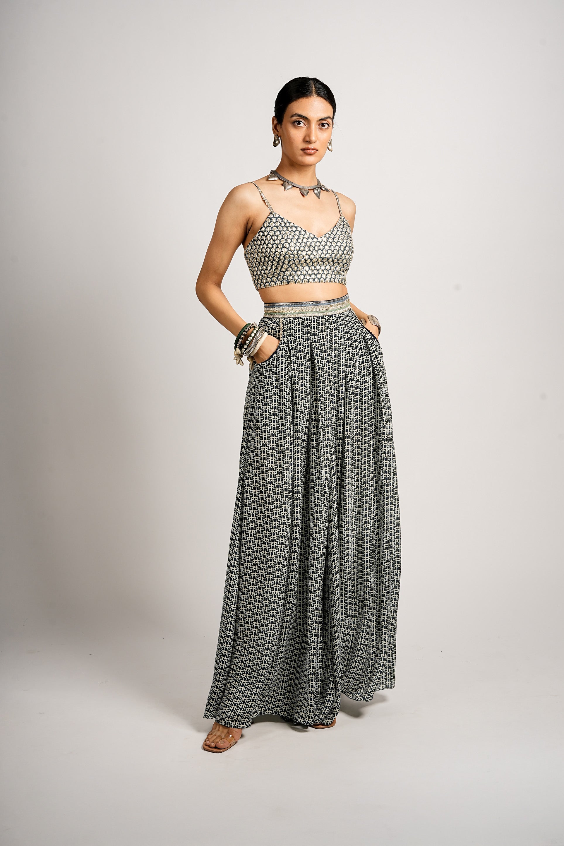 MEHRA CAPE JACKET WITH PLEATED PANTS AND BUSTIER