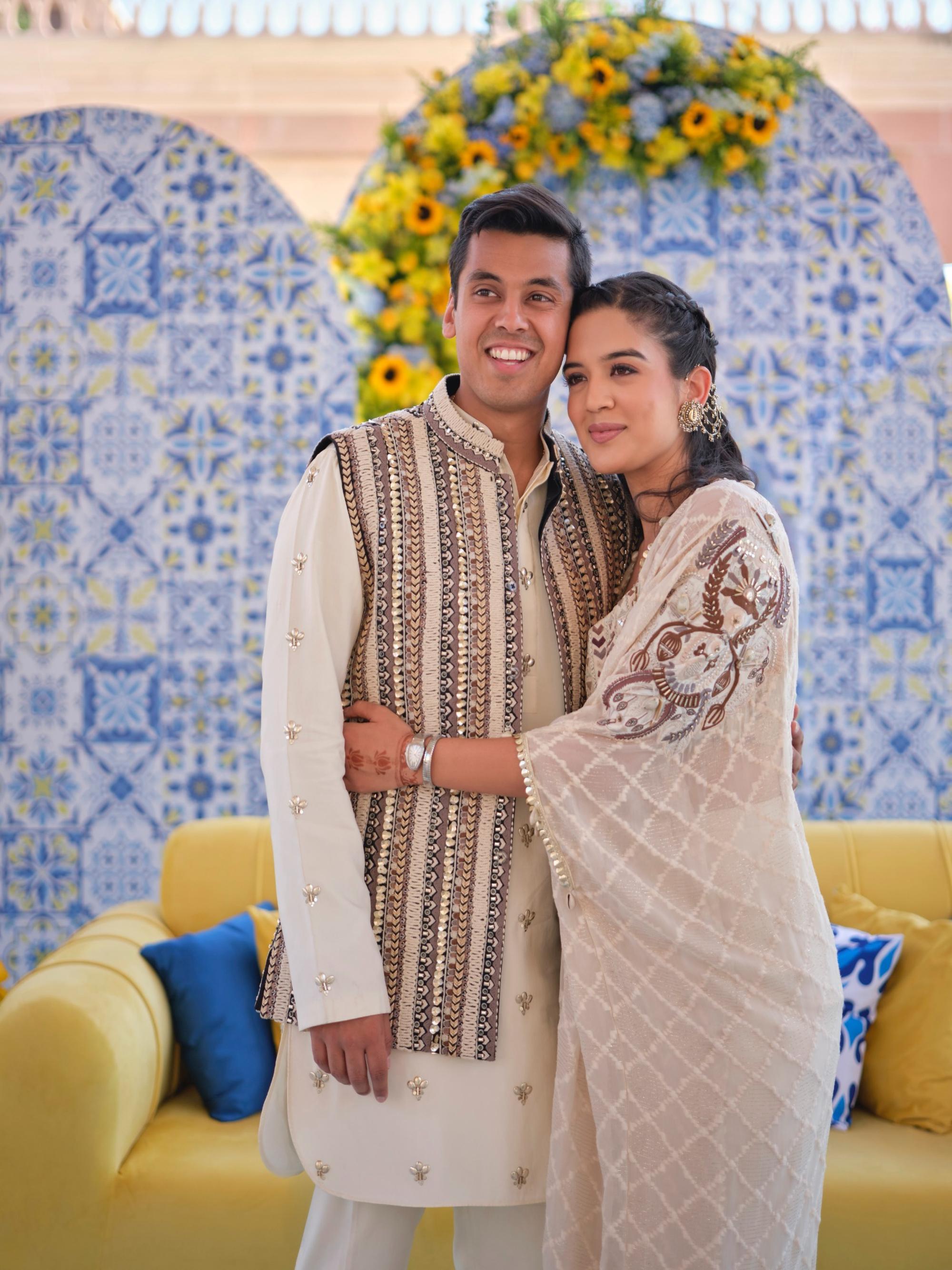 Ivory threadwork bundi paired paired with metal embellished kurta and pants