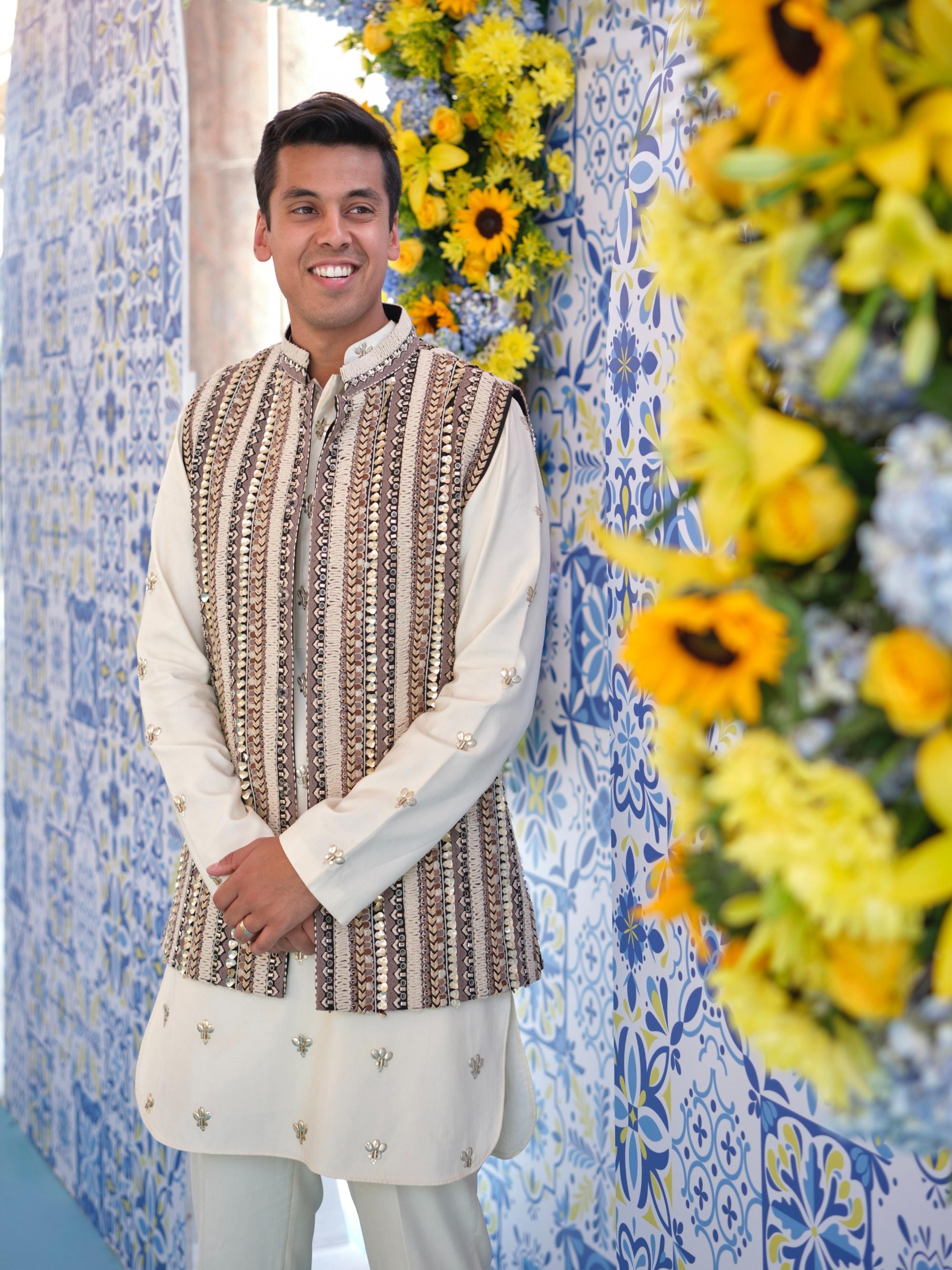 Ivory threadwork bundi paired paired with metal embellished kurta and pants
