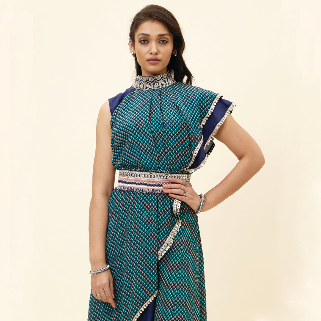 BLUE CROP TOP WITH BLUE BUTTI PRINT DRAPE AND BLUE SOLID PLAIN SILK DRAPE WITH BLUE BUTTI PRINT SHARARA PANTS AND EMB BELT