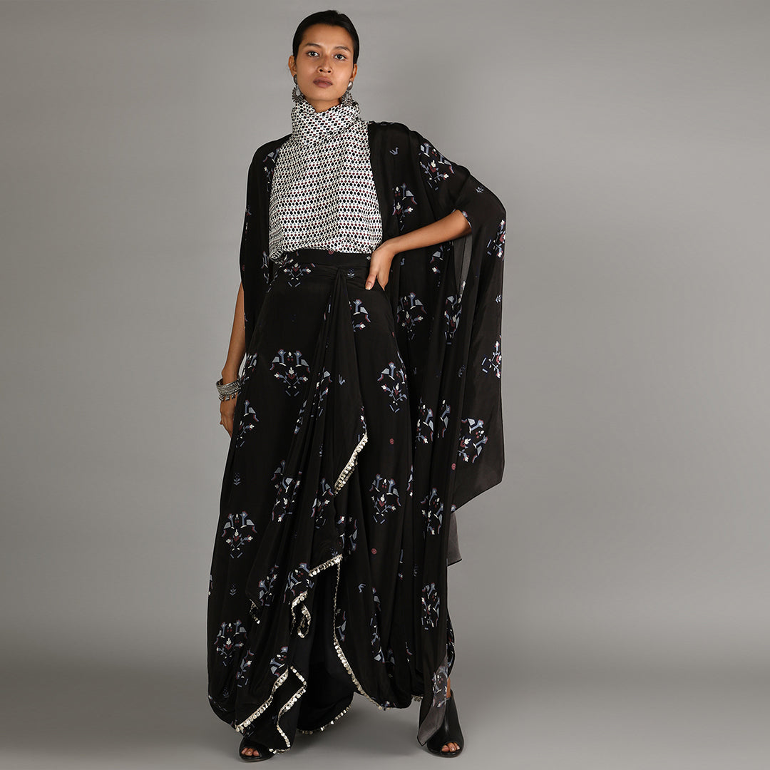 Jaali Print White Turtle Neck Top Paired With Black Bird Print Drape Skirt With Cape