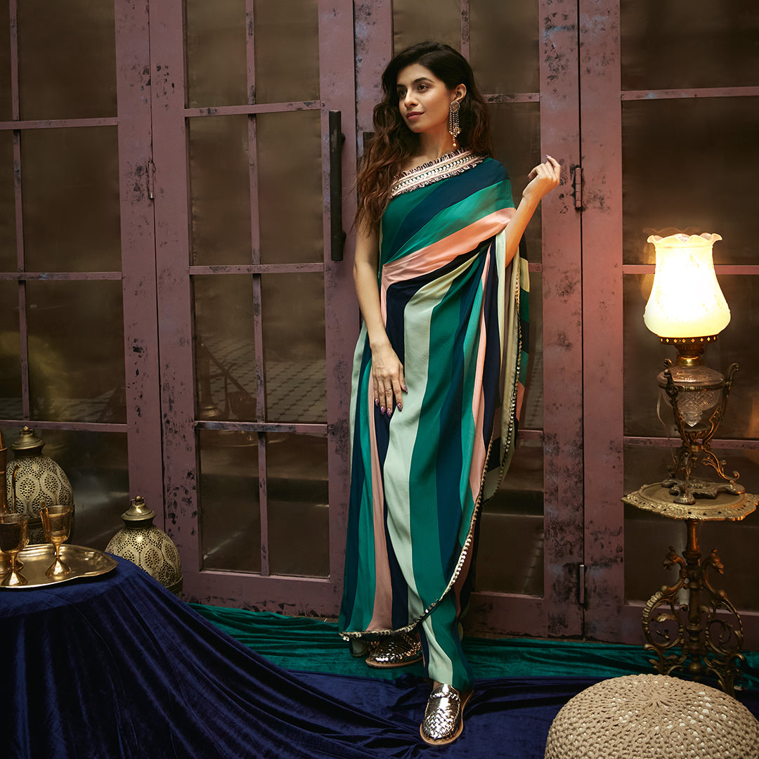 STRIPES PRINT ONE SHOULDER DRAPED SAREE TEAMED WITH PANTS