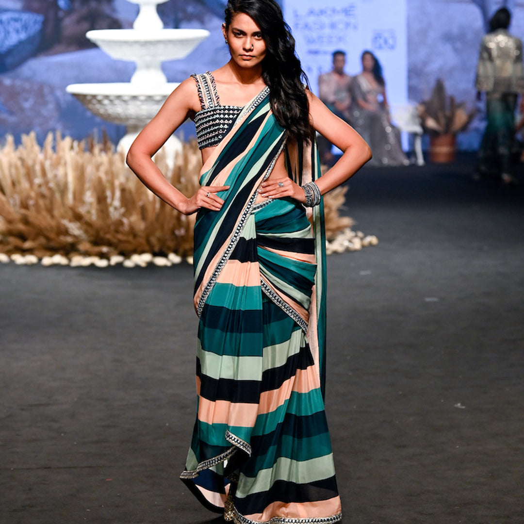 STRIPE PRINT PRE STITCHED CASCASE SAREE TEAMED WITH AN EMBELLISHED BANDEAU BLOUSE